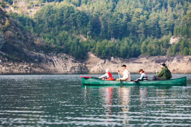 istock Father with son canoeing at the mountain lake 1464775745