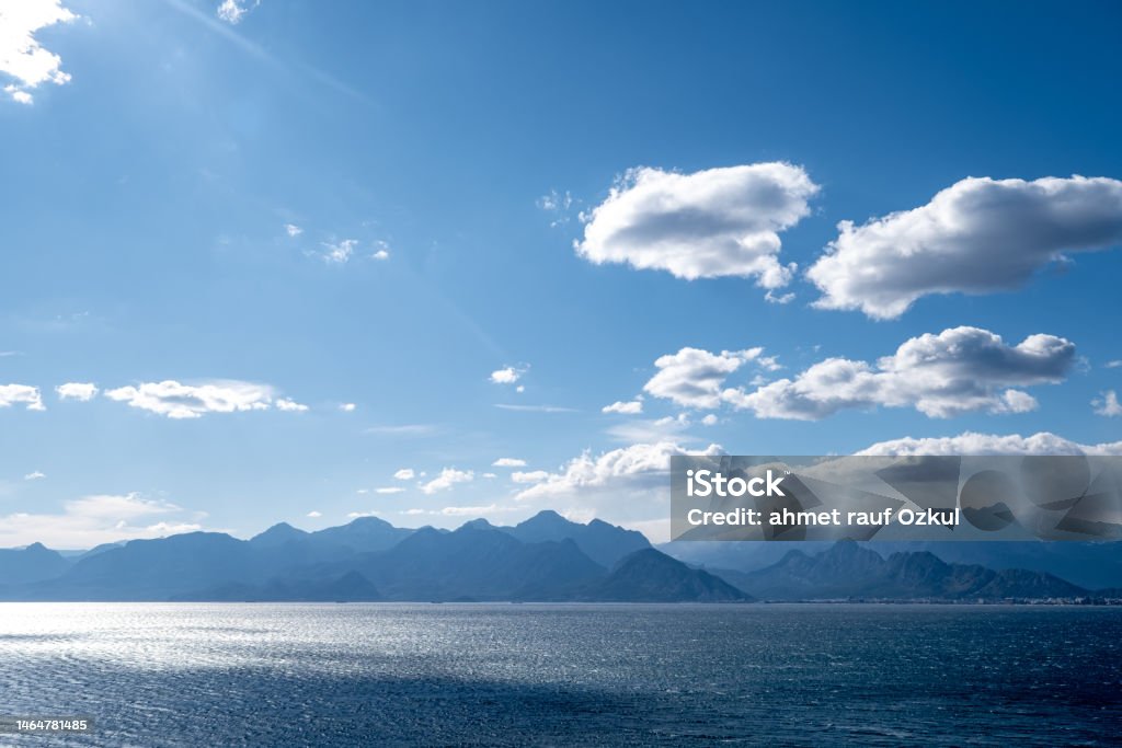 Mountains and mediterranean landscape surrounded by cloud Windy weather wavy seascape and mountain range.Clear cloud aerial mediterranean landscape Antalya Province Stock Photo