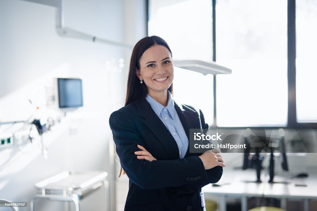 Portrait of young woman director in hospital room. Portrait of young woman director in a hospital room. Healthcare And Medicine Stock Photo