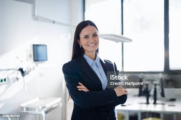 Portrait Of Young Woman Director In Hospital Room Stock Photo - Download Image Now - Healthcare And Medicine, Manager, Administrator