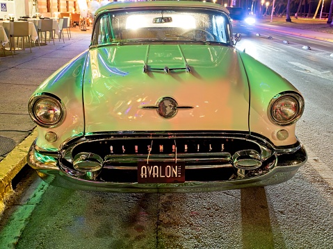 Miami South Beach, Florida - USA, February 1, 2023. A 1955 Oldsmobile 88 parked in front of the Avalon hotel Miami Beach Florida. One of the most photographed automobiles in the world,
