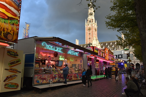 Brussels, Belgium- 09-19-2022: Visitors walk past various vendors at the annual fair in Leuven.