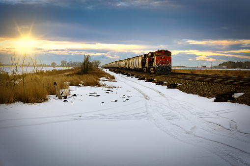 A freight train sits idle on the tracks during sunset at Fort Morgan, Colorado.