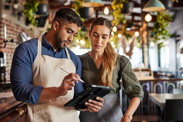 istock Tablet checklist, bartender or small business people for communication, networking or online order check. Research, planning startup or teamwork for inventory stock management or social media review 1464787923