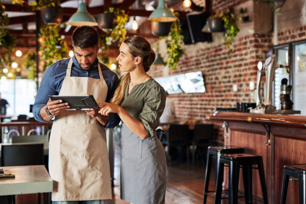 istock Tablet, waiter or business people for communication, networking or online order check. Research, planning reservation or collaboration for inventory checklist, stock management or social media review 1464788084