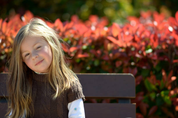 istock Girl looking doubdful in the park 1464788233