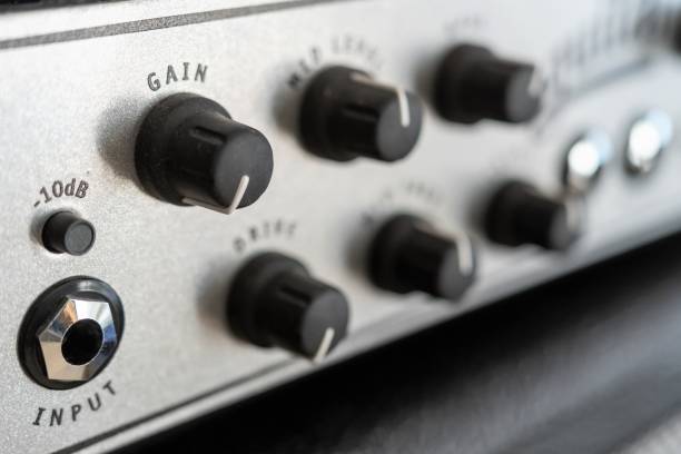 istock Guitar amplifier, an electronic device designed to amplify an electrical sound signal emitted by an electric guitar. Close-up 1464790549