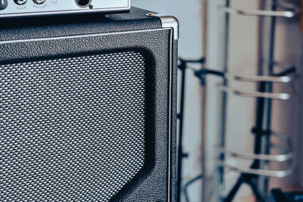 istock Guitar amplifier, an electronic device designed to amplify an electrical sound signal emitted by an electric guitar. Close-up 1464790552