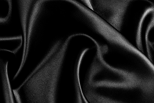Black satin wavy background.