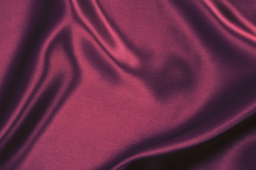 Purple satin wavy background.