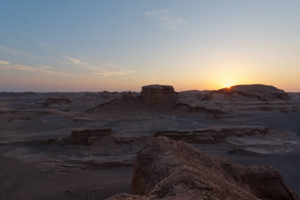 istock Serene sunset over the amazing Dasht-e Lut Desert and its rock formations (Kaluts), Kerman Province, Iran 1464793086