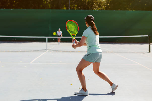 istock Woman playing tennis 1464793099