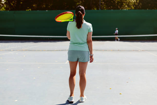 istock Woman playing tennis 1464793134
