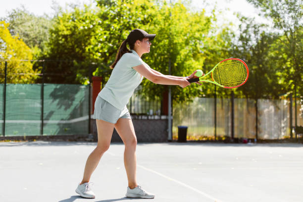 istock Woman playing tennis 1464793183