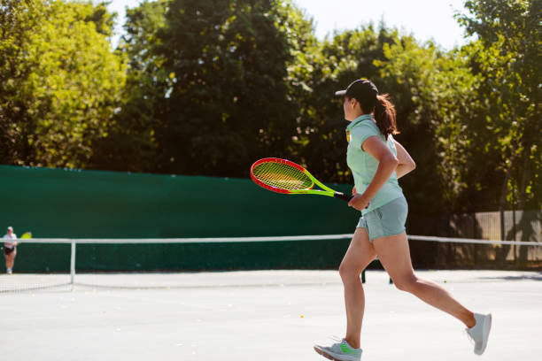 istock Woman playing tennis 1464793204