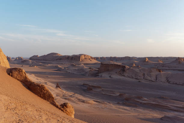 istock Serene sunset over the amazing Dasht-e Lut Desert and its rock formations (Kaluts), Kerman Province, Iran 1464794629