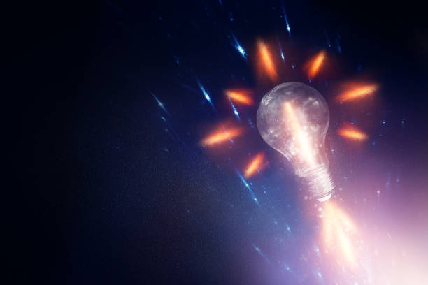istock Light bulb over dark black background. Concept of creativity and innovation 1464796078
