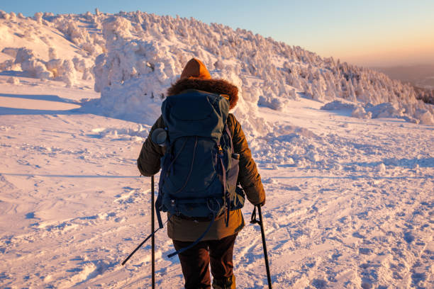 istock Hiking in snow at winter mountains during sunset 1464801745