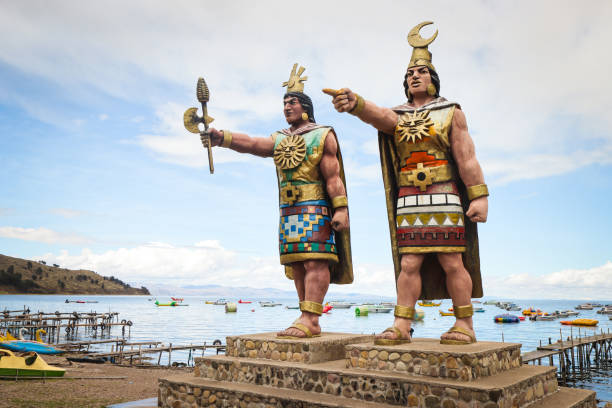 Two statues of the Incan Sun and Moon gods stand on the shores of Copacabana in Bolivia