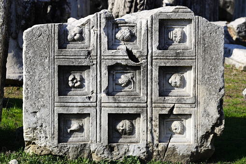 Ancient gravestone on Cape Cod depicting a smiling winged angel  and the words \