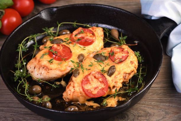 istock Chicken breast with cheese and tomatoes 1464817493