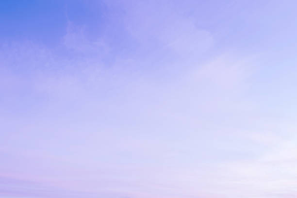 Sky with soft and fluffy pastel lilac pink and blue colored clouds. Sunset background. Nature. sunrise. Instagram toned style
