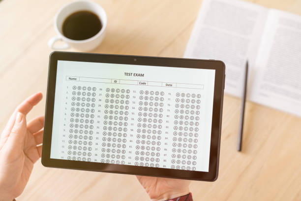 istock Online exam. girl student testing exercise. Examination test on the tablet for school, university. multiple choice answer sheet. Home school, online study. Pandemic, online study 1464818159
