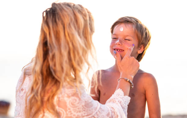 istock Mom puts sunscreen on the child's face. 1464827160