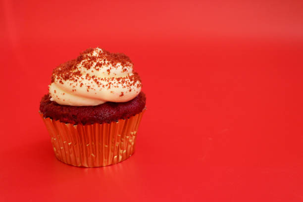 Tasty Red Velvet Cup Cake on Red Background