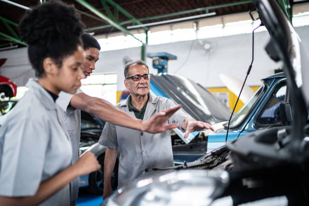istock Auto mechanics analyzing the car engine on the repair shop 1464834277