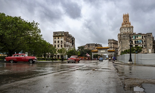 Havana, Cuba, December 9, 2017: View of the traffic in the historic district of Havana on a rainy day.