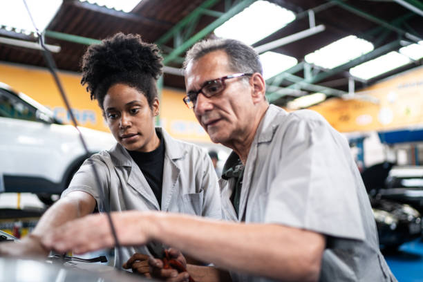 istock Autp mechanics analyzing the car engine on the repair shop 1464834392