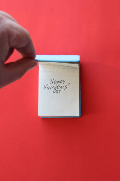 istock Happy valentine's day lettering in notepad. 1464834525