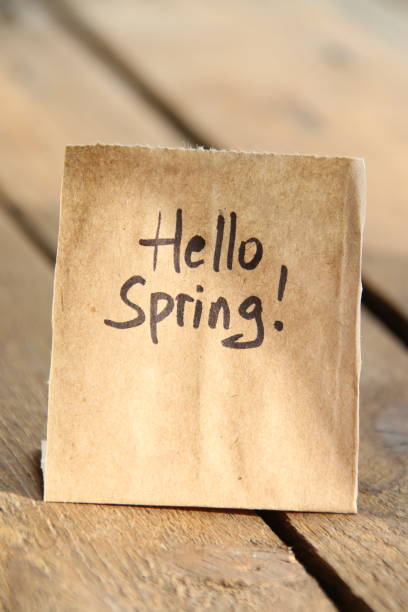 istock Hello Spring. The inscription on the tag. Vintage style. 1464834526