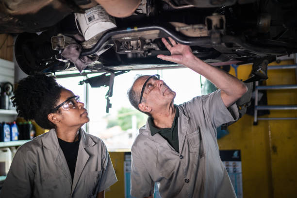 istock Auto mechanics analyzing the car engine on the repair shop 1464836142