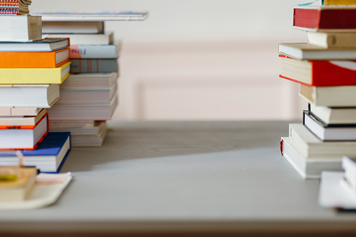 A close up view of a table with different literature. (reading, studying, learning, education concept)