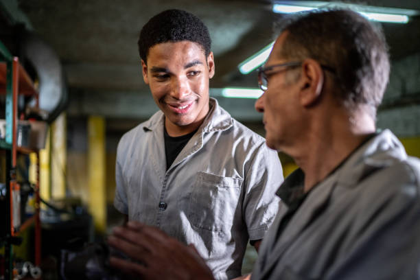 istock Auto mechanics talking on a repair shop 1464837134