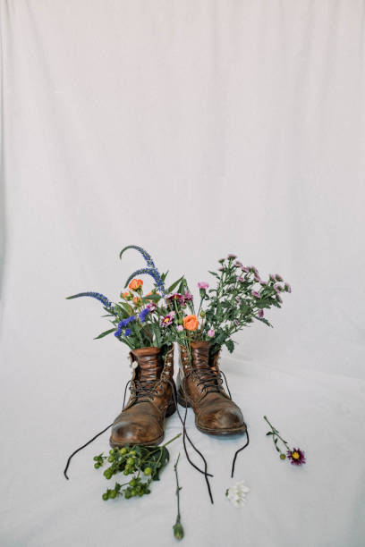 istock Work boots with flowers - stock photo 1464839509