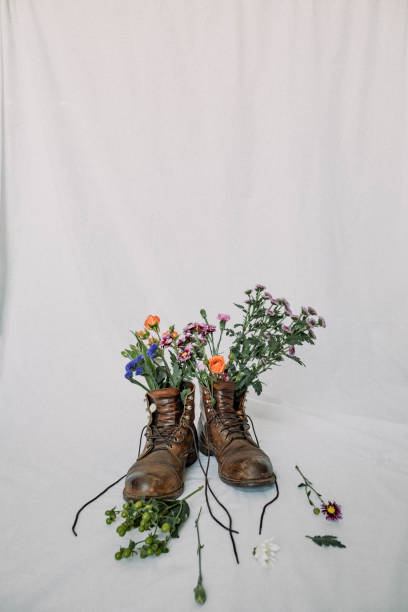 istock Work boots with flowers - stock photo 1464839512