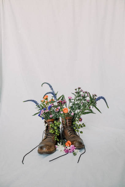istock Work boots with flowers - stock photo 1464839521