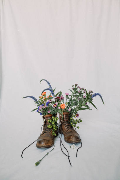istock Work boots with flowers - stock photo 1464839527