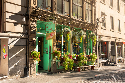 Montreal, Canada - September 25, 2021:  Traditional cafe or bistro restaurant along the historic cobblestone streets of Old Town Montreal, Quebec Canada