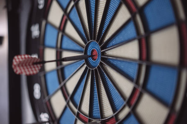 istock Dart hitting the center bull's eye 1464844728