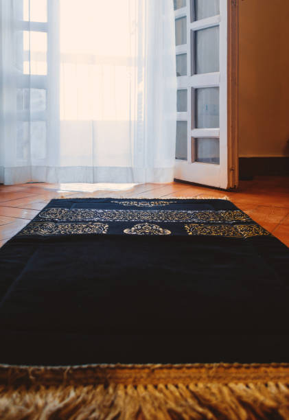 istock Islamic black prayer rug  with golden decoration 1464847749