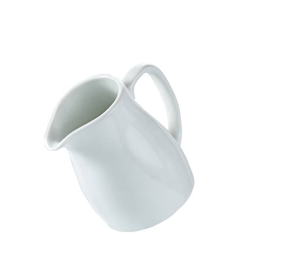 istock small milk jar or creamer isolated on white background. 1464850407