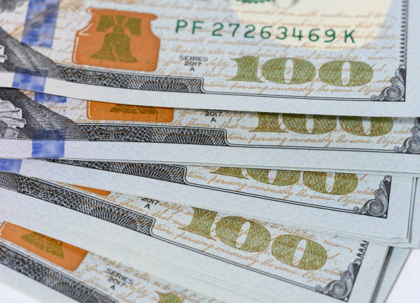 istock Fragment of paper hundred dollar bills 1464850408