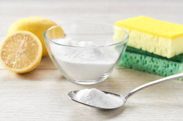 istock non-toxic cleaner, baking soda and lemon on a white kitchen table. 1464850424