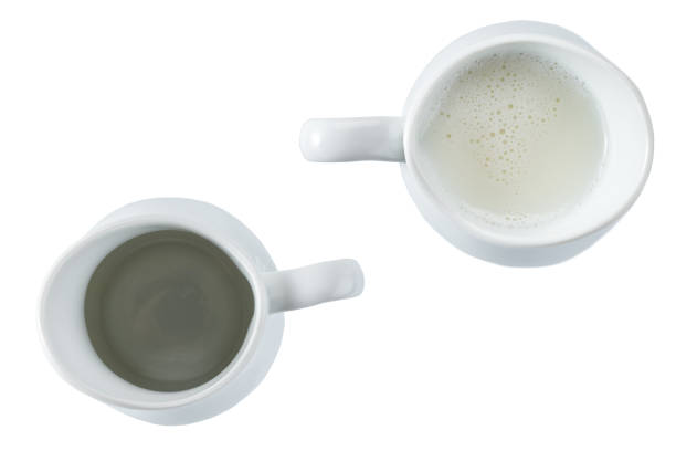 istock small milk jar or creamer isolated on white background, top view. 1464850448