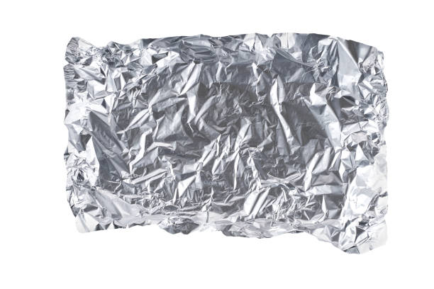 istock White shiny aluminum foil wrap isolated on a white background, top view. 1464850464