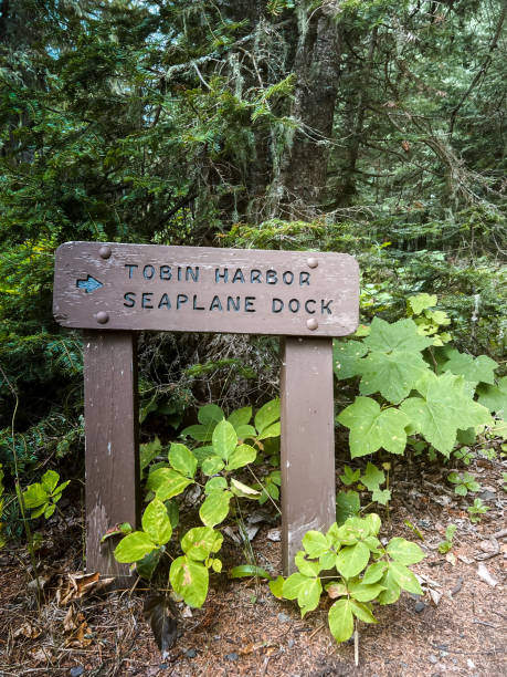 istock Rustic National Park Sign Points to Seaplane Dock 1464853121